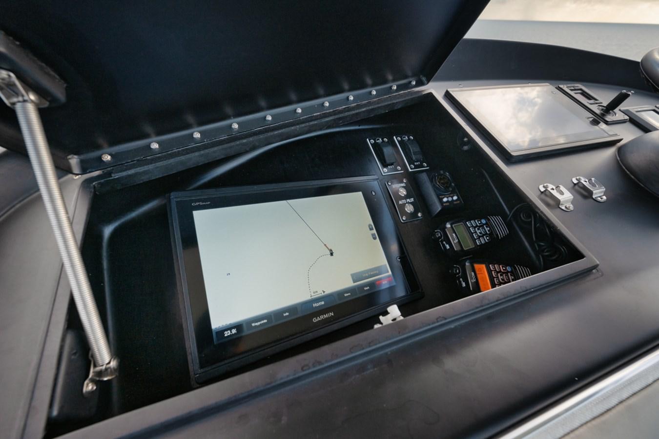a black electronic device aboard OWL'S NEST Yacht for Sale