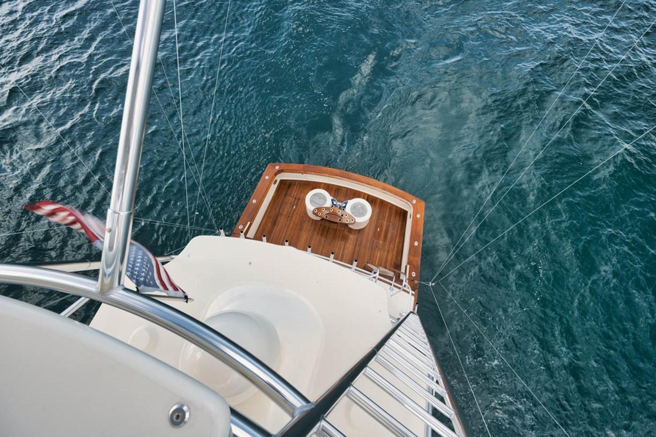 a boat with a wooden dock aboard OWL'S NEST Yacht for Sale