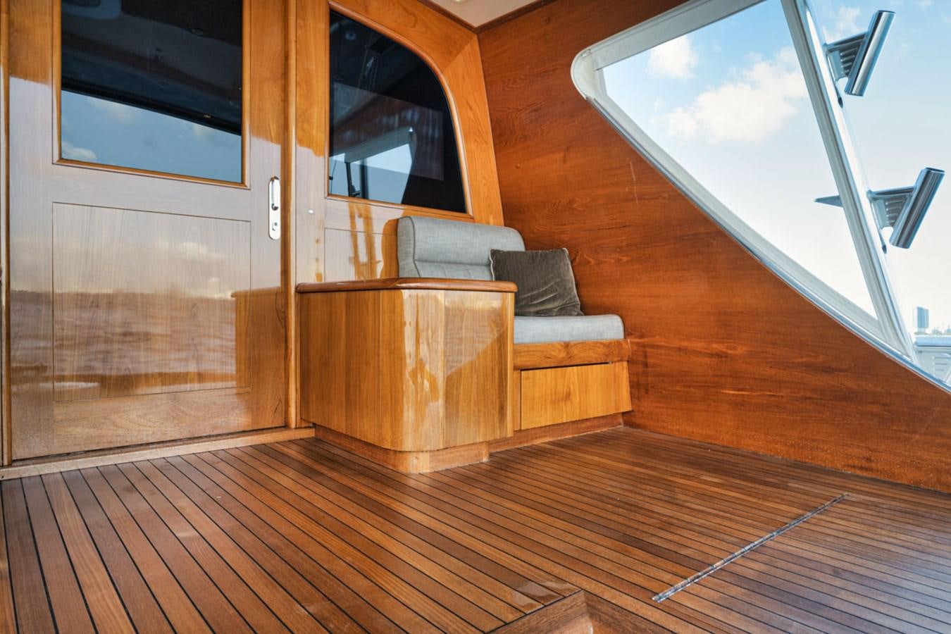 a room with a couch and a window aboard OWL'S NEST Yacht for Sale