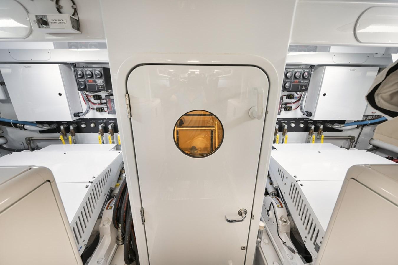 a white machine with a brown circle aboard OWL'S NEST Yacht for Sale