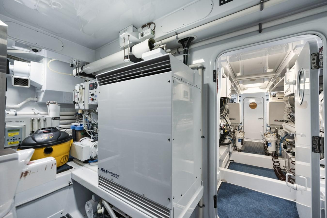 a large machine in a room aboard OWL'S NEST Yacht for Sale