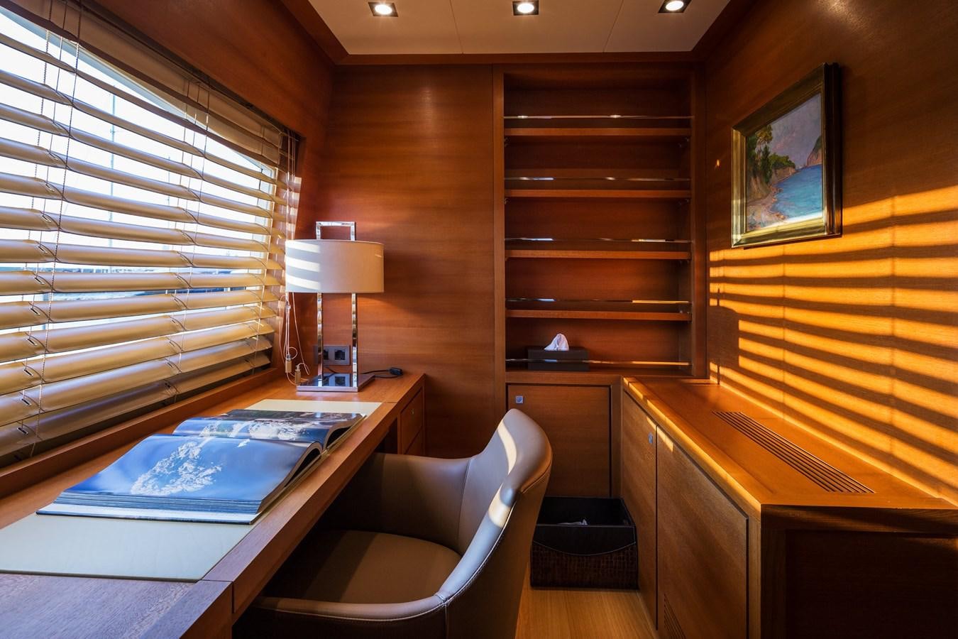 a room with a bed and a desk aboard WATER TOY III Yacht for Sale