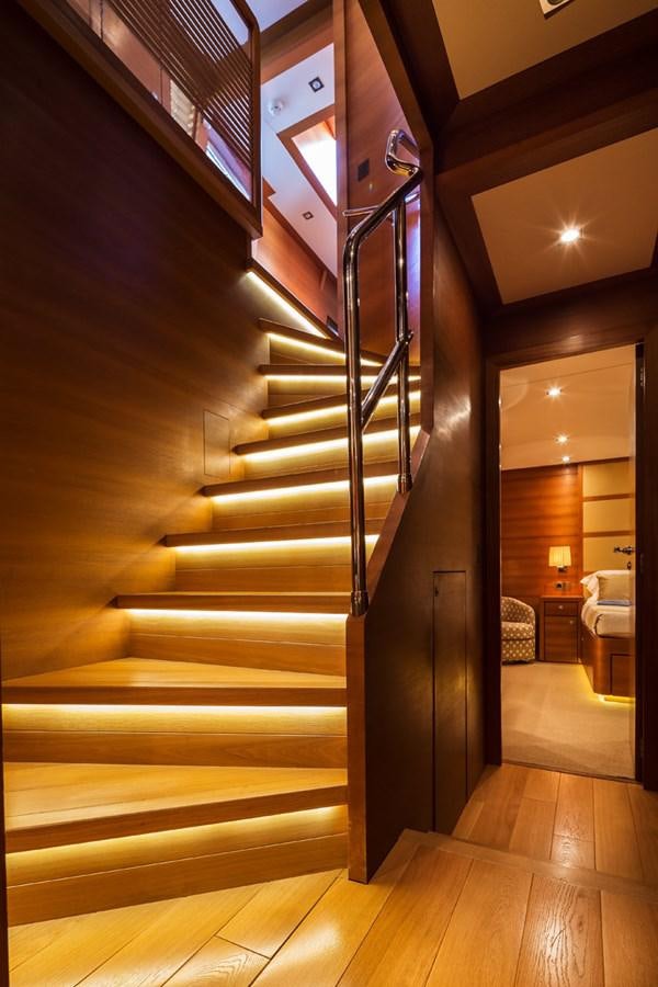 a wooden staircase with a wood floor aboard WATER TOY III Yacht for Sale