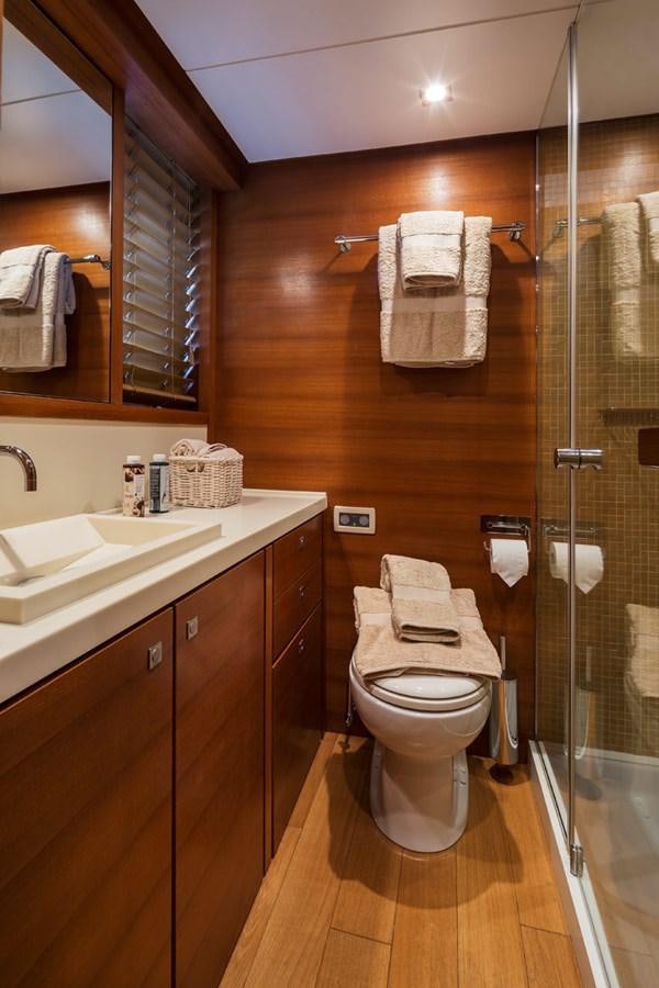 a bathroom with a shower and sink aboard WATER TOY III Yacht for Sale