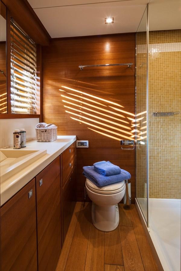 a bathroom with a shower and sink aboard WATER TOY III Yacht for Sale