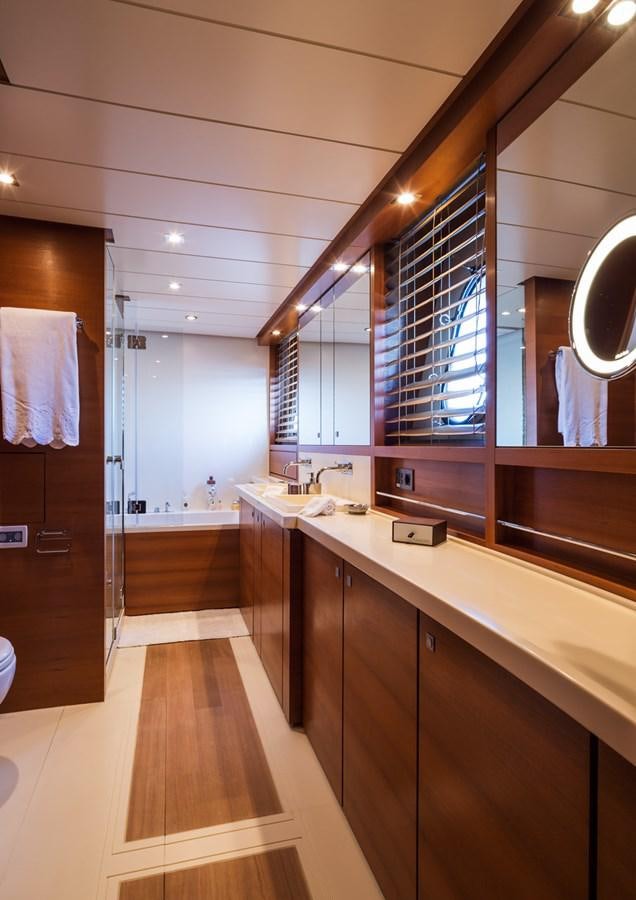 a bathroom with a large mirror aboard WATER TOY III Yacht for Sale