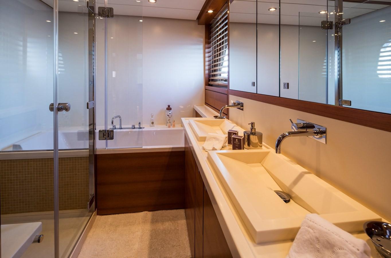 a bathroom with a large mirror aboard WATER TOY III Yacht for Sale