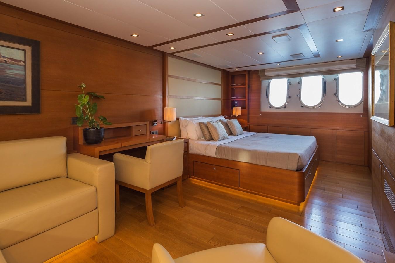a room with a bed and a couch aboard WATER TOY III Yacht for Sale