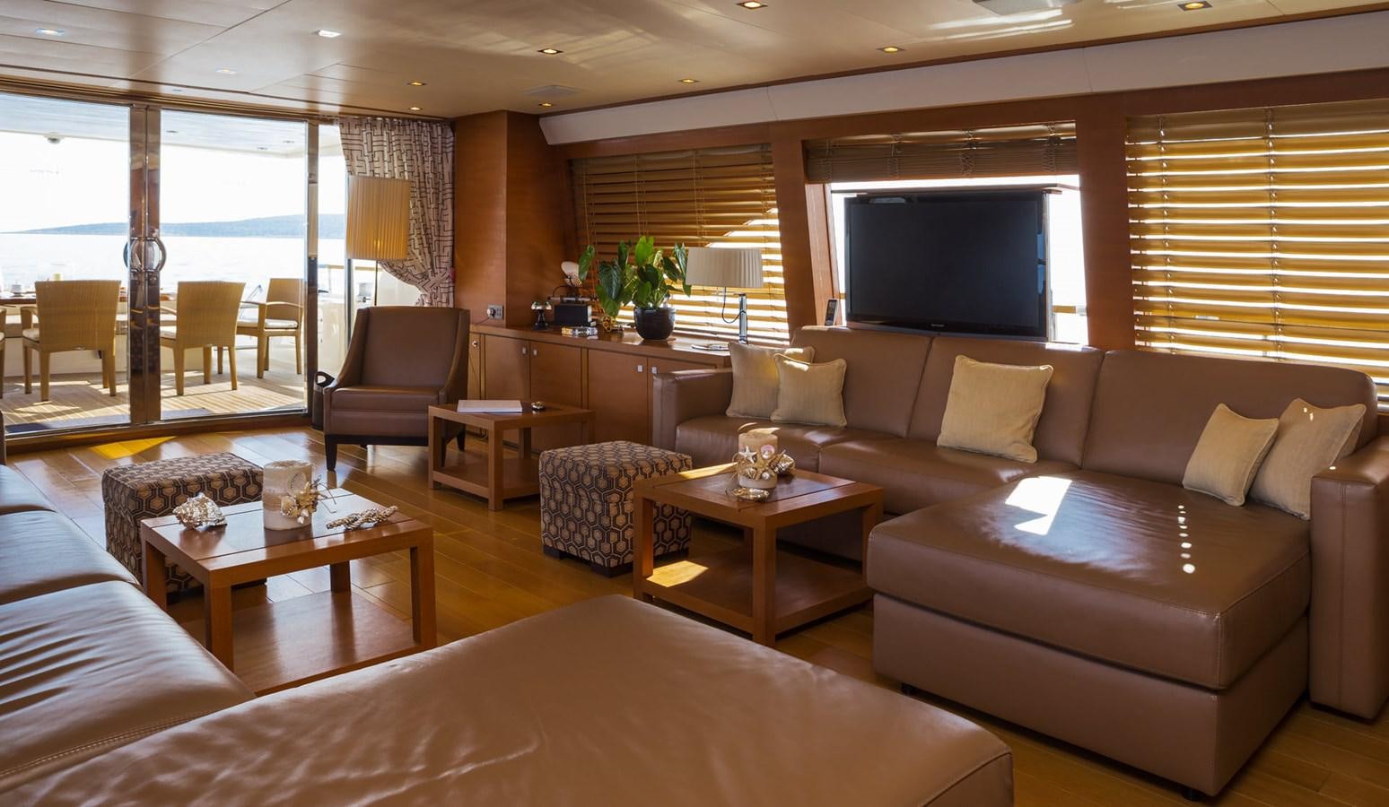 a living room with a large window aboard WATER TOY III Yacht for Sale