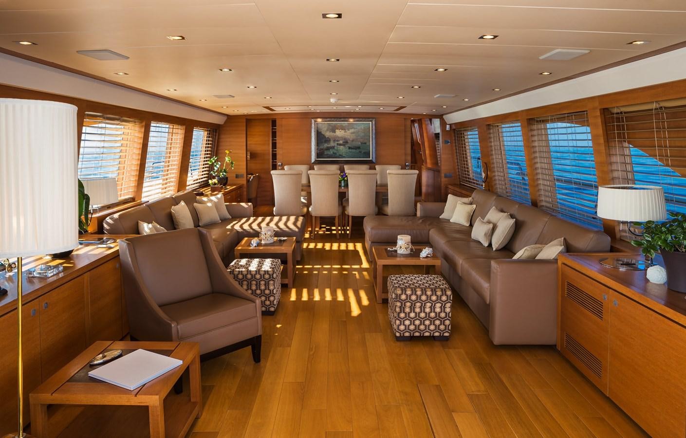 a living room with a large window aboard WATER TOY III Yacht for Sale