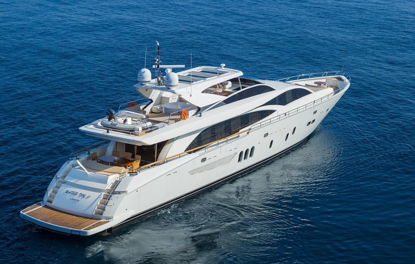 a white yacht in the water aboard WATER TOY III Yacht for Sale