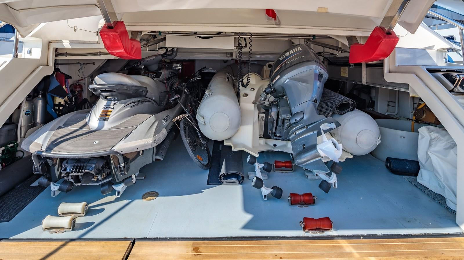 a car with a hood aboard WATER TOY III Yacht for Sale