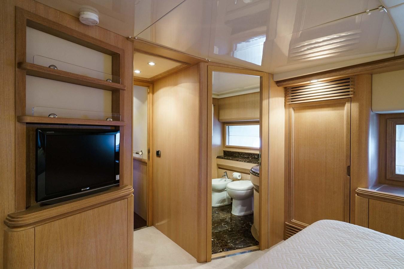 a bathroom with a bed and a television aboard ALLIE Yacht for Sale