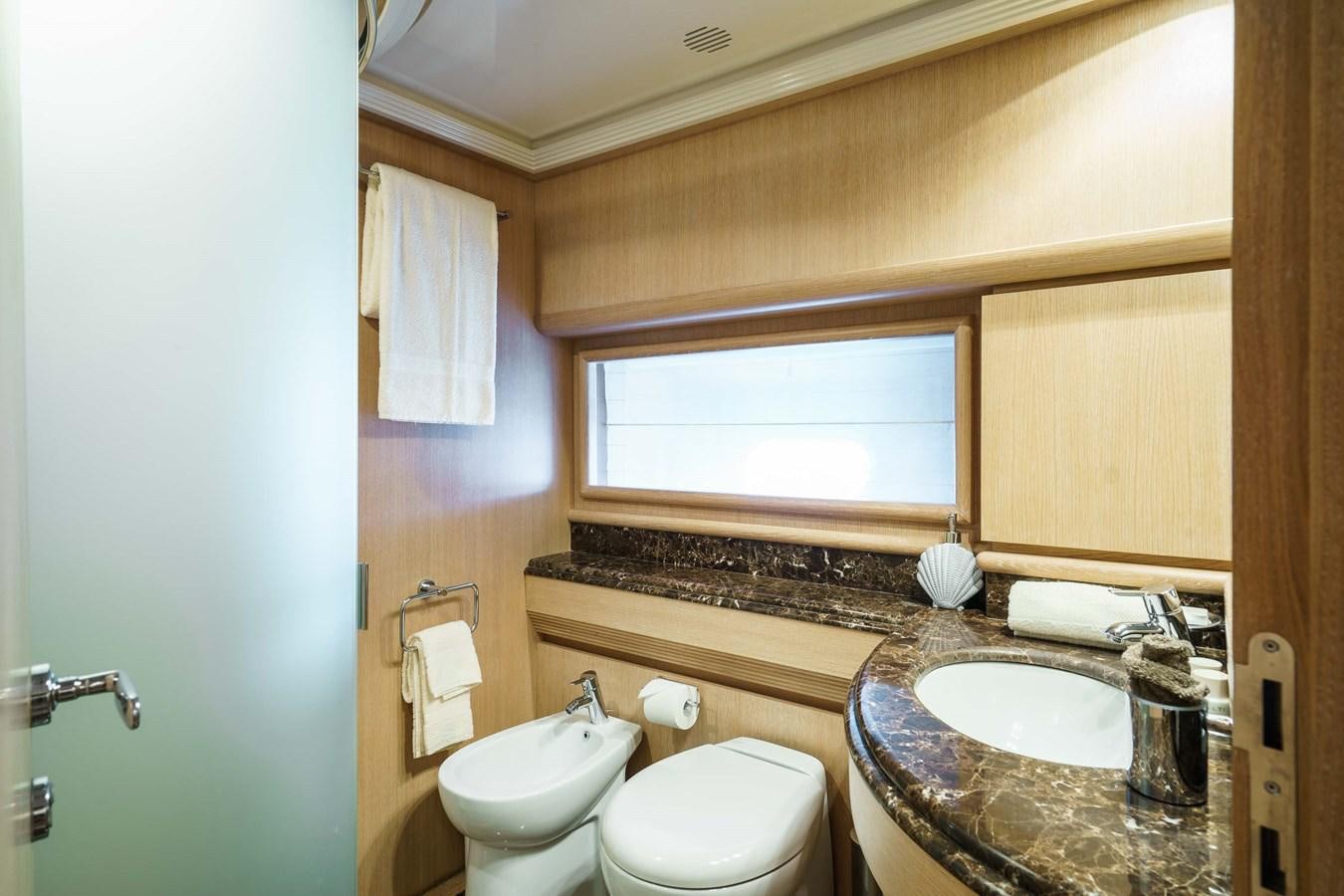 a bathroom with a sink and a toilet aboard ALLIE Yacht for Sale