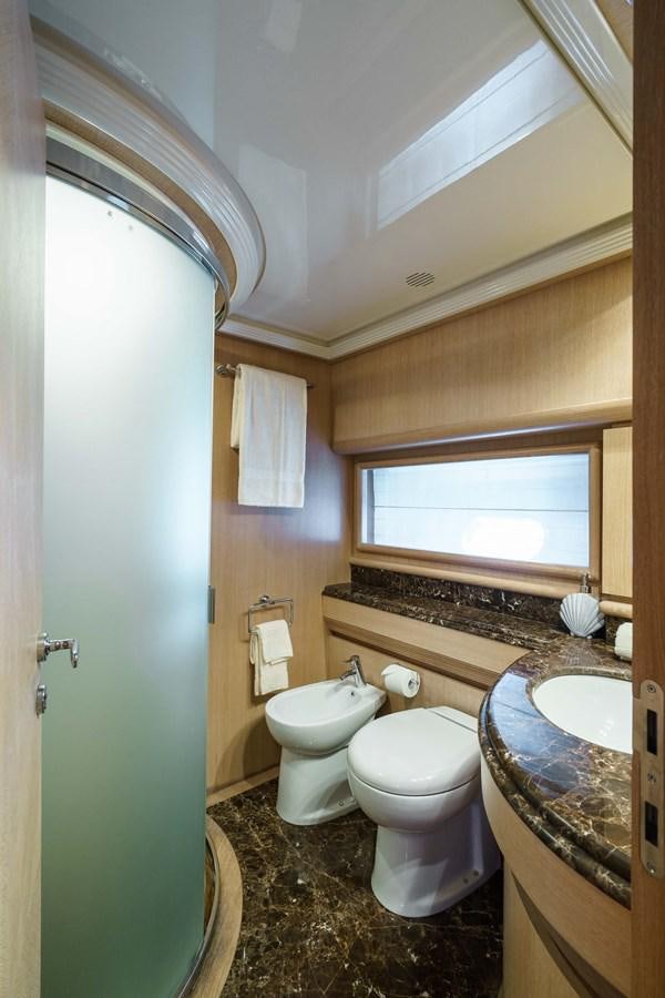 a bathroom with a toilet and sink aboard ALLIE Yacht for Sale
