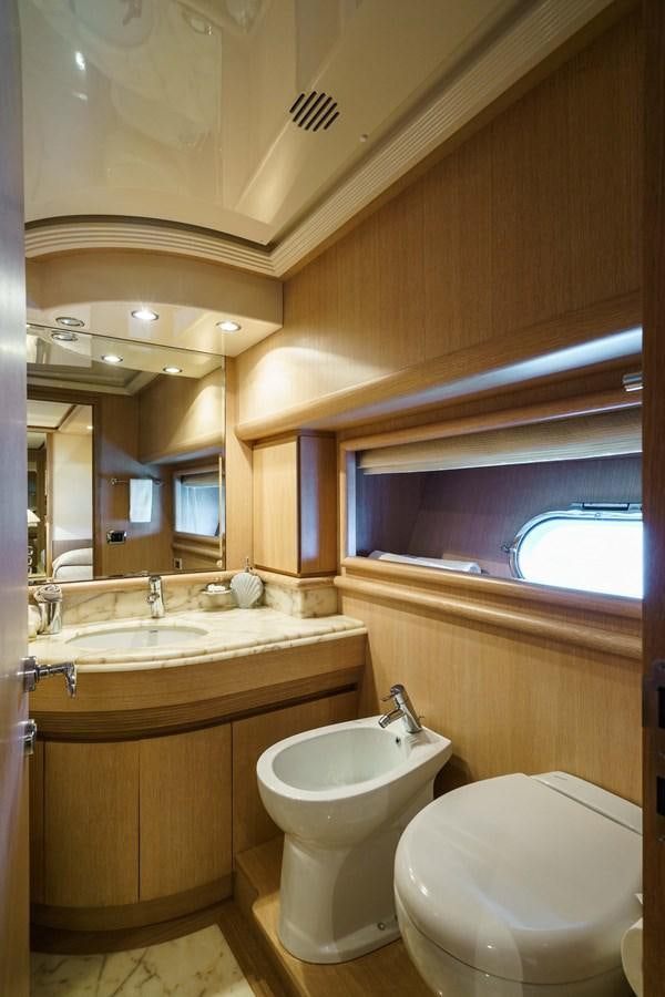 a bathroom with a toilet and a sink aboard ALLIE Yacht for Sale