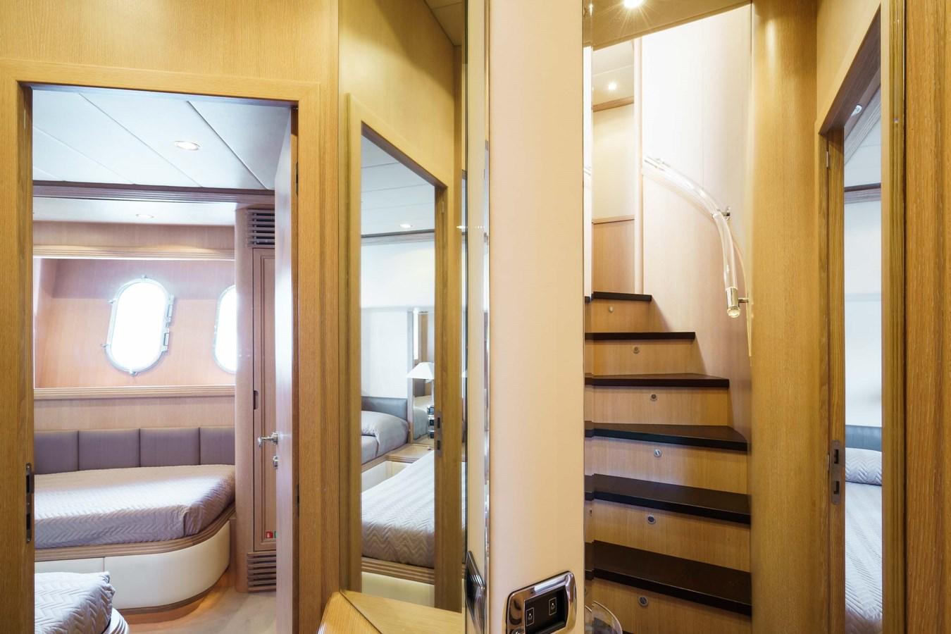 a room with a bed and a door aboard ALLIE Yacht for Sale