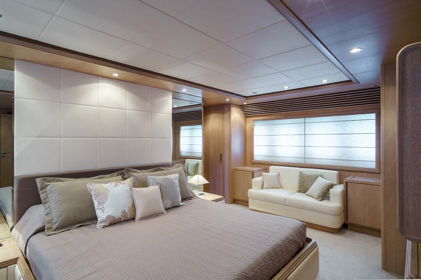 a room with a bed and a couch aboard ALLIE Yacht for Sale