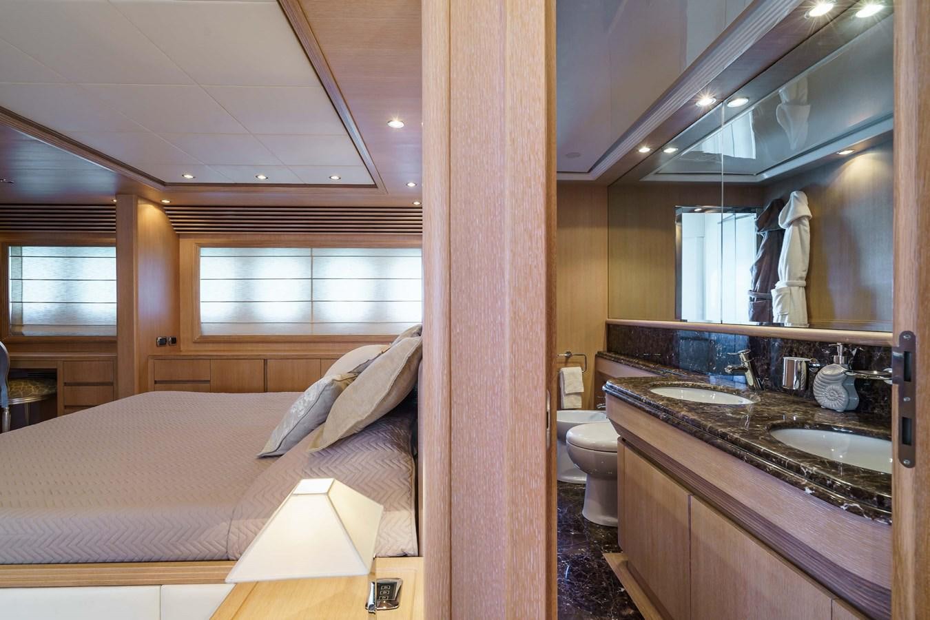 a bathroom with a sink and a bed aboard ALLIE Yacht for Sale
