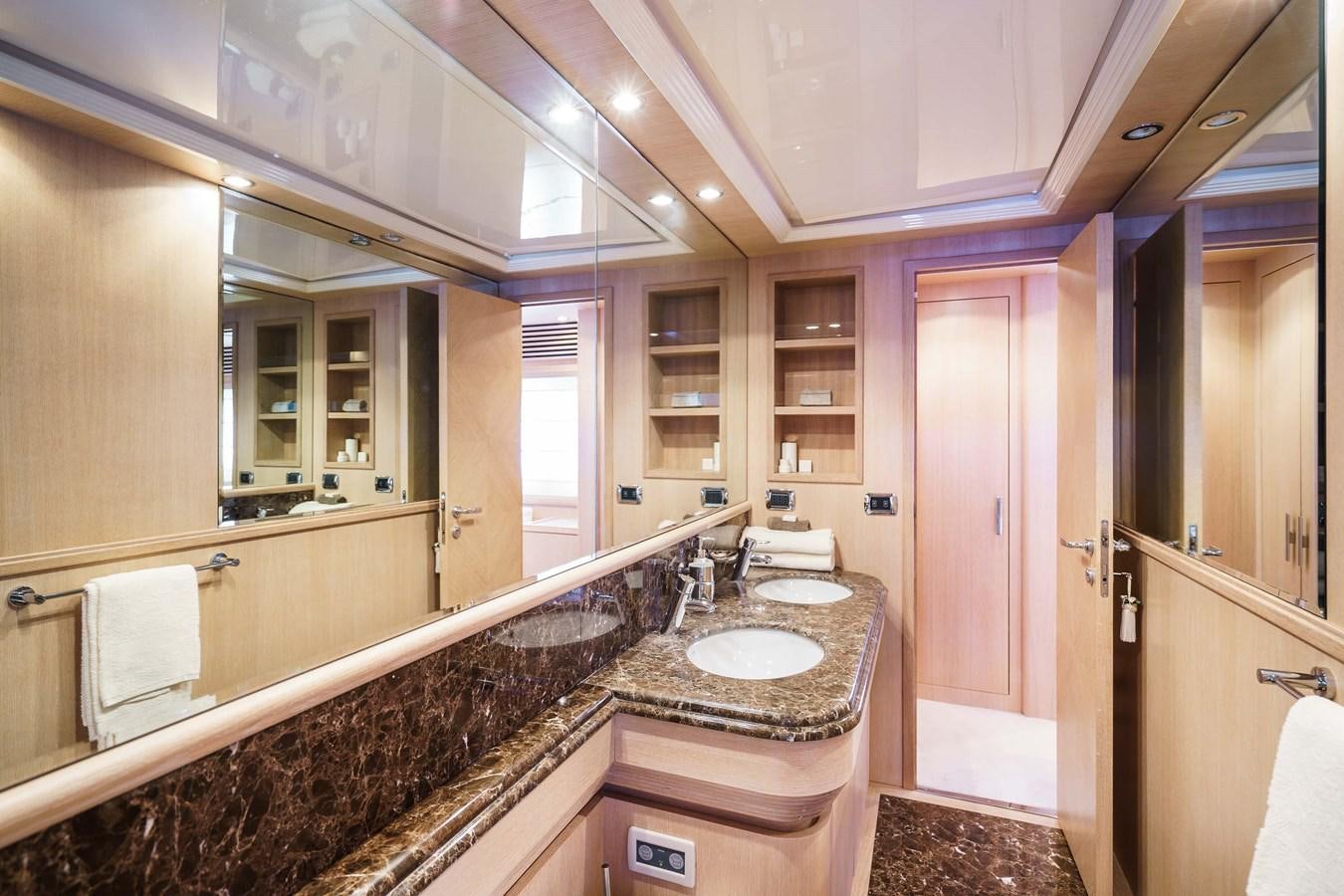 a bathroom with a countertop sink and mirror aboard ALLIE Yacht for Sale