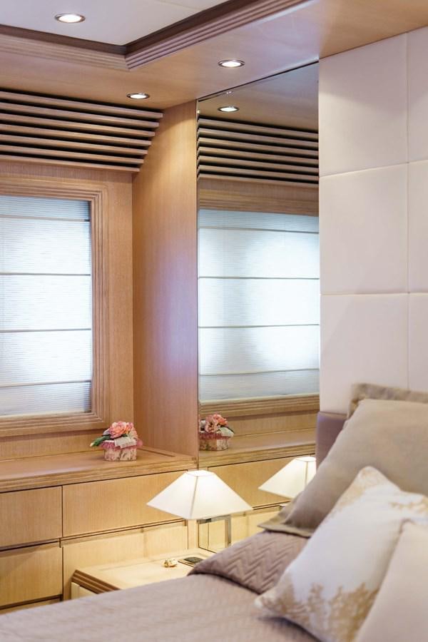 a bedroom with a bed and a window aboard ALLIE Yacht for Sale