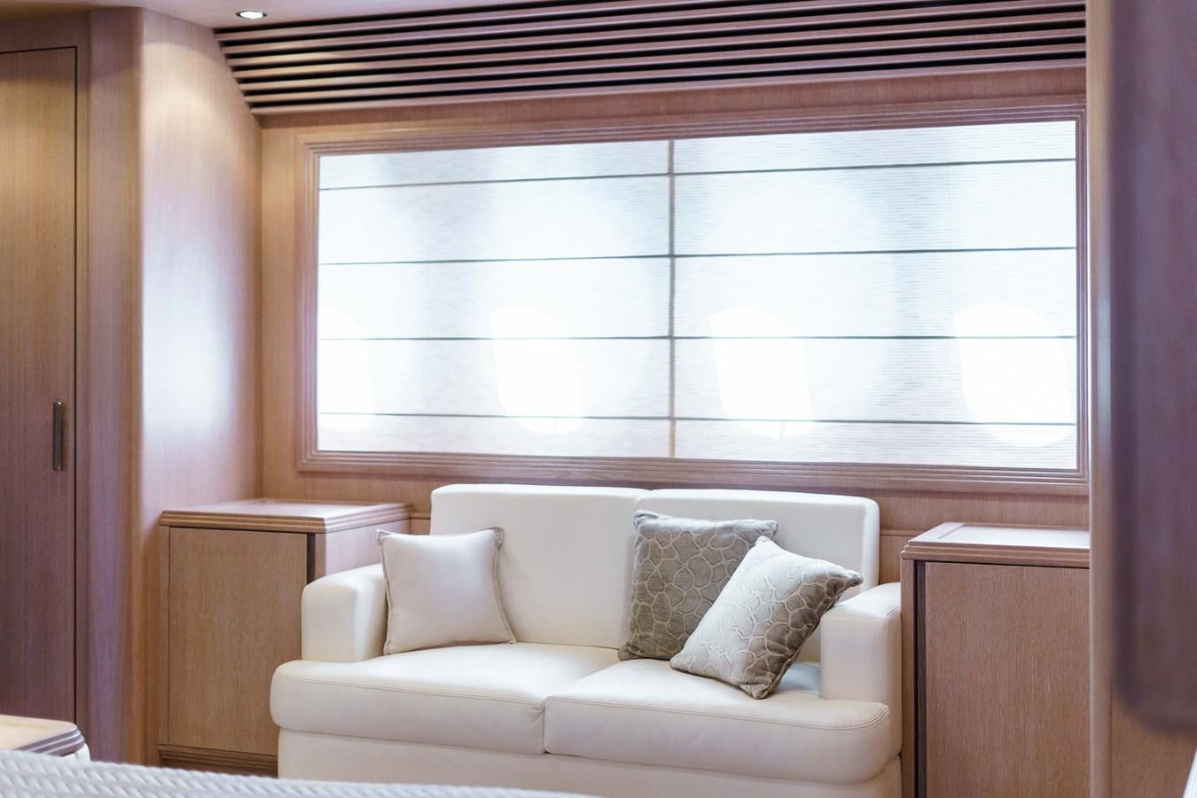 a white couch in a room aboard ALLIE Yacht for Sale