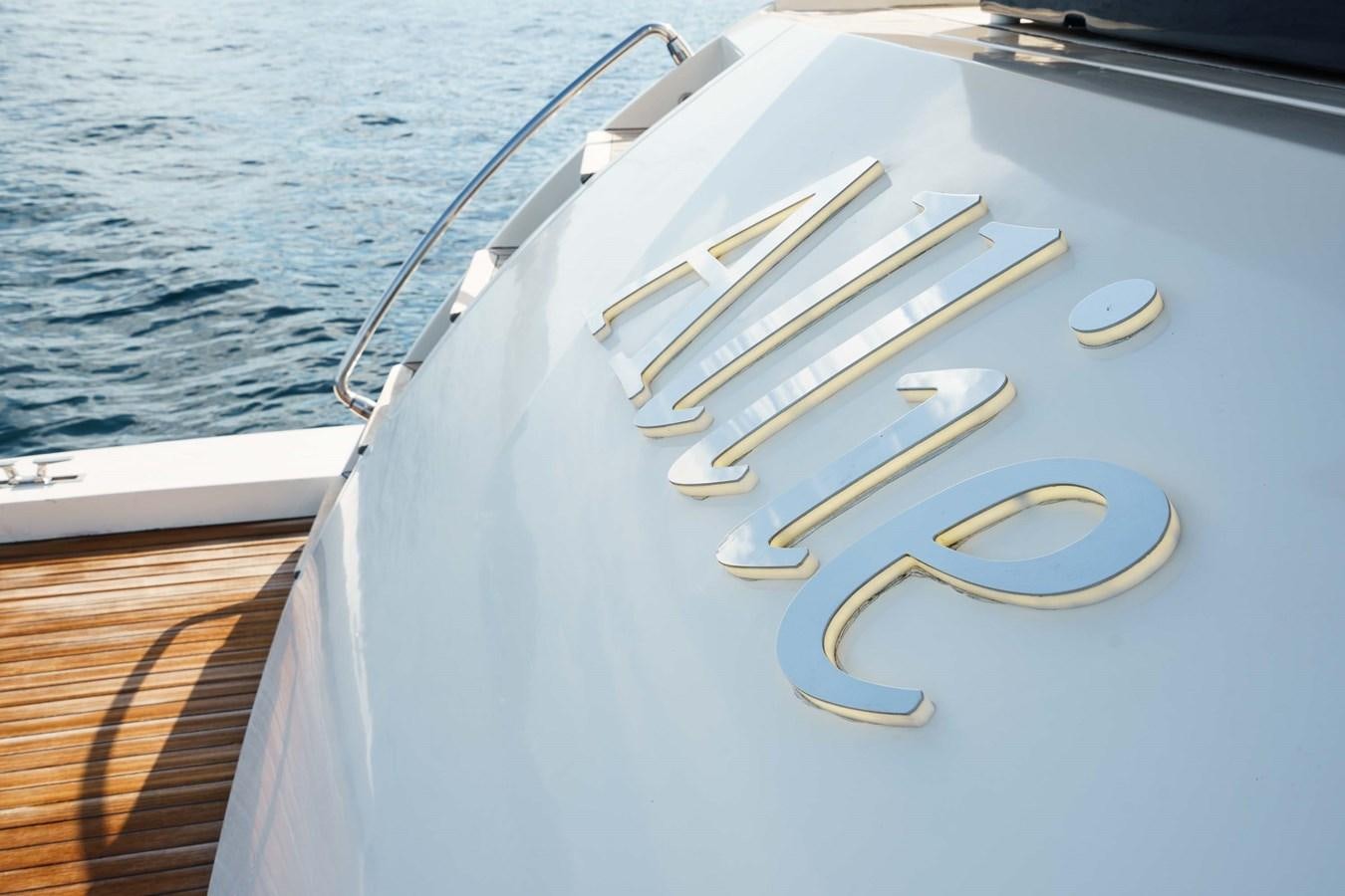 a white boat with gold trim aboard ALLIE Yacht for Sale
