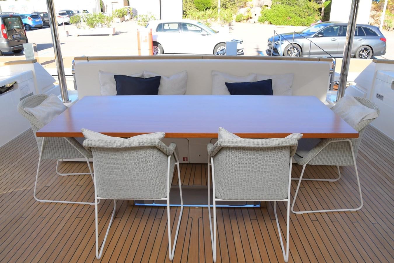 a table and chairs on a deck aboard VICTORIA VIENNA Yacht for Sale
