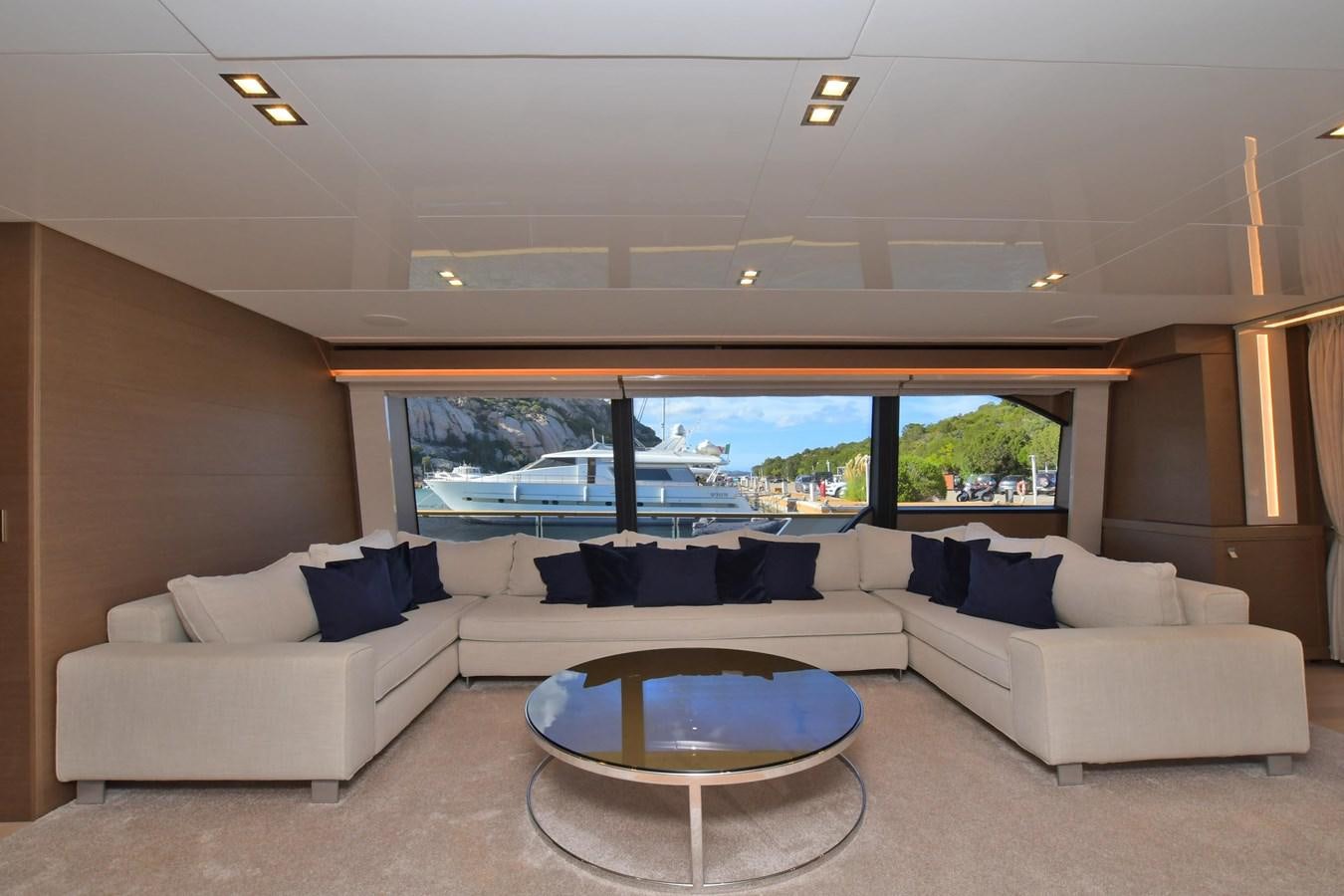 a living room with a large window aboard VICTORIA VIENNA Yacht for Sale