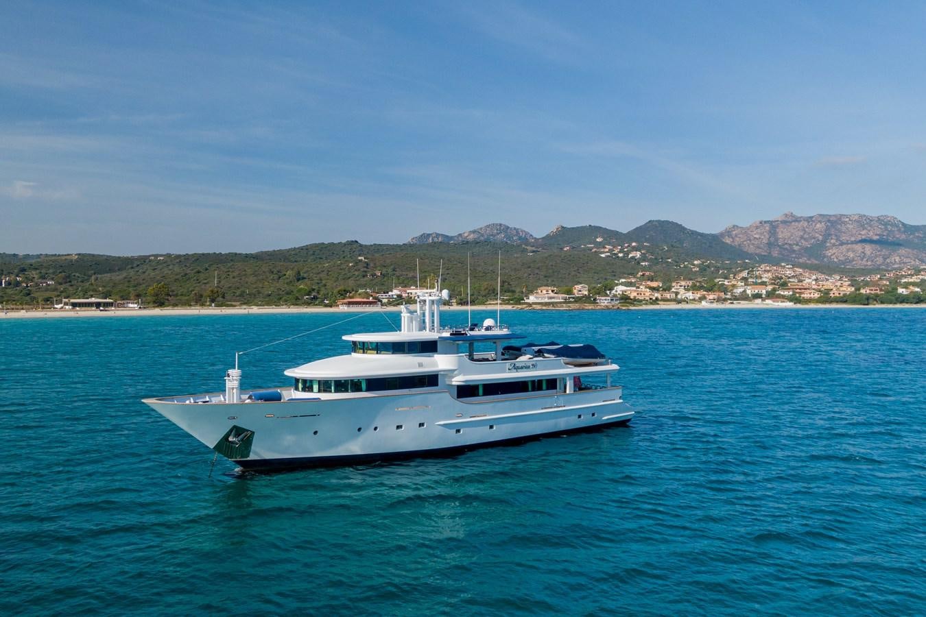 a white yacht in the water aboard AQUARIUS IV Yacht for Sale