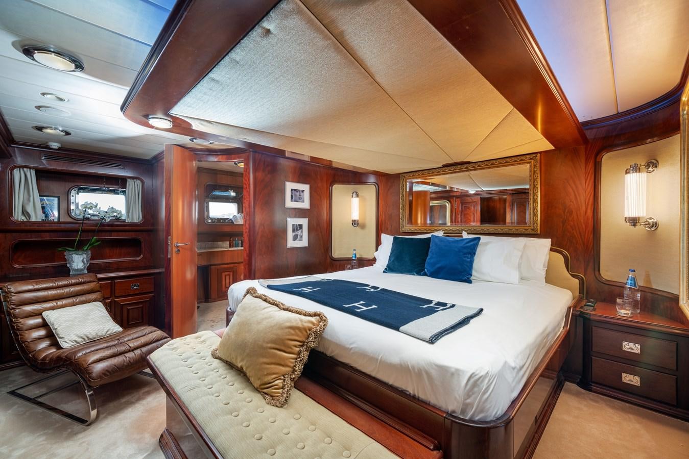 a bed in a room aboard AQUARIUS IV Yacht for Sale