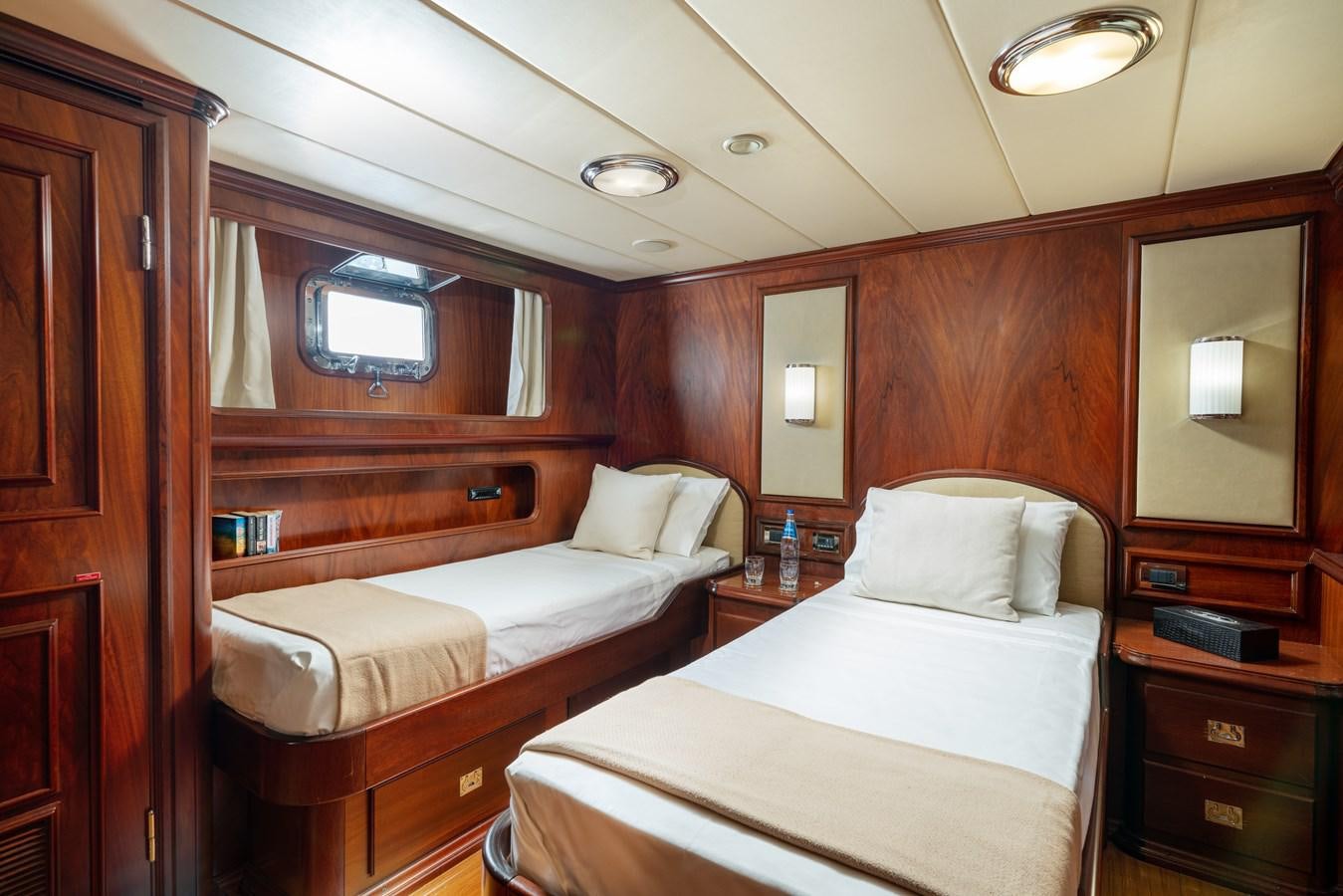 a room with two beds aboard AQUARIUS IV Yacht for Sale