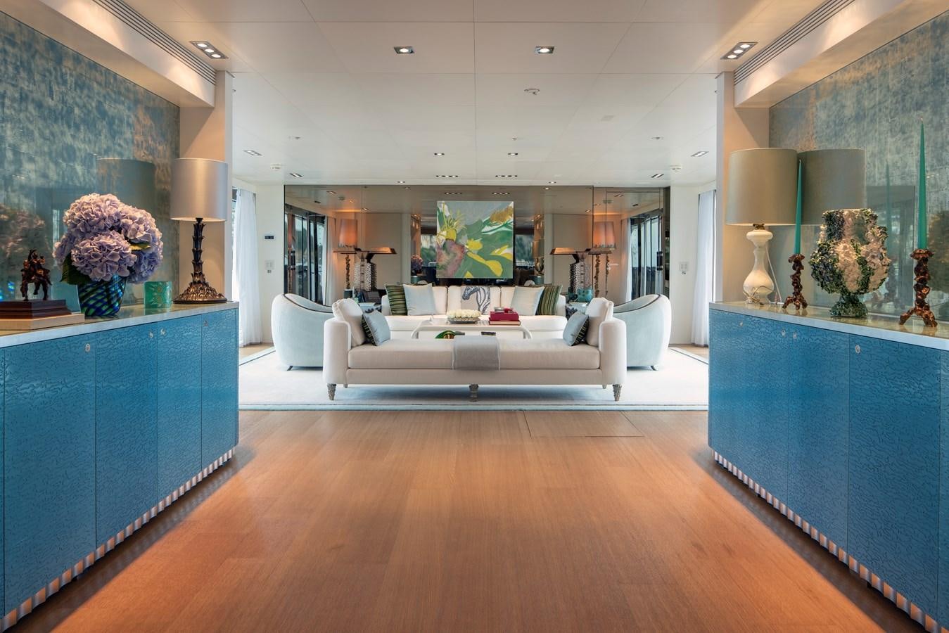 a living room with a white couch aboard MRS L Yacht for Sale