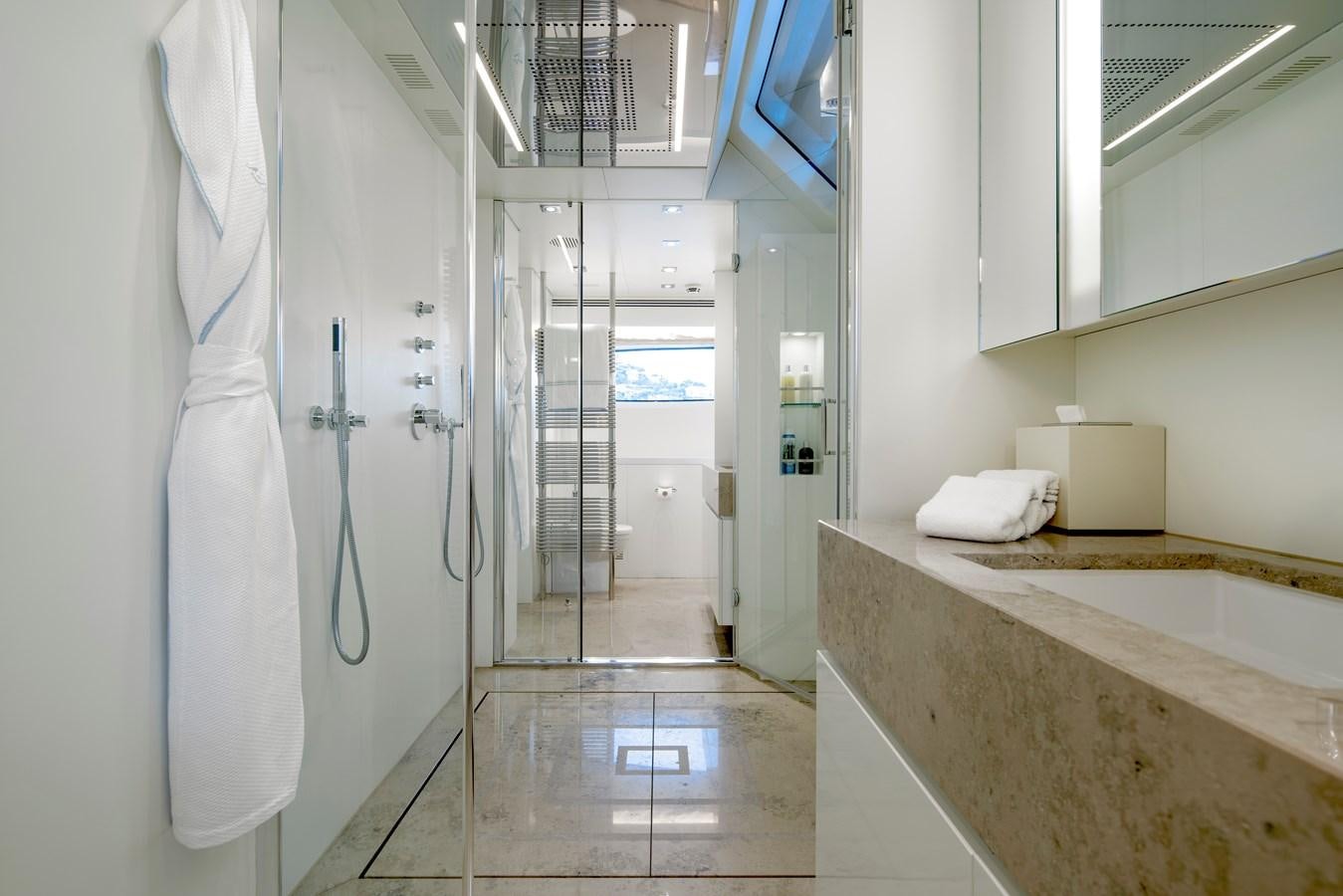 a bathroom with a countertop sink and a mirror aboard MRS L Yacht for Sale