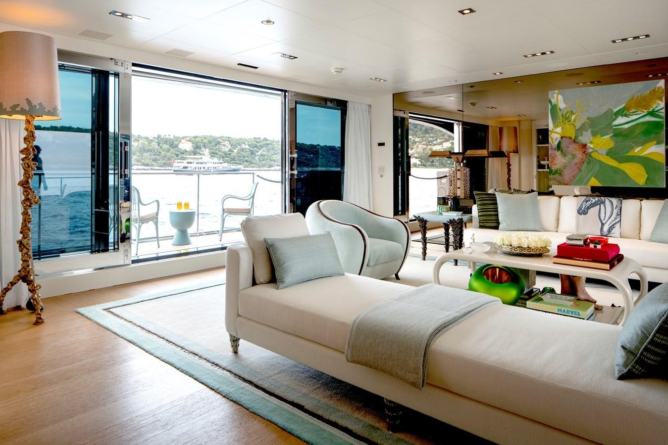 a living room with a large window aboard MRS L Yacht for Sale
