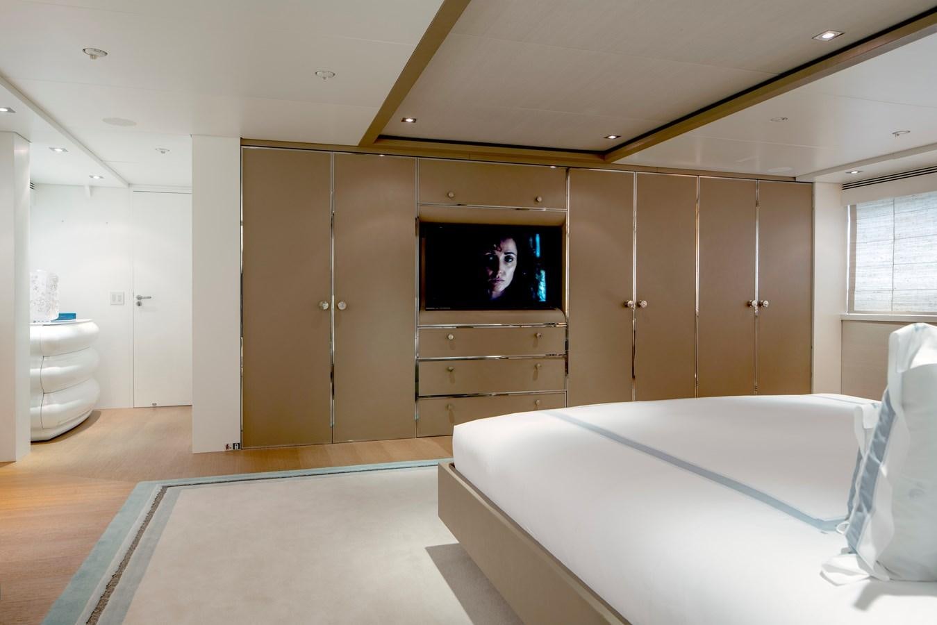 a room with a bed and a television aboard MRS L Yacht for Sale