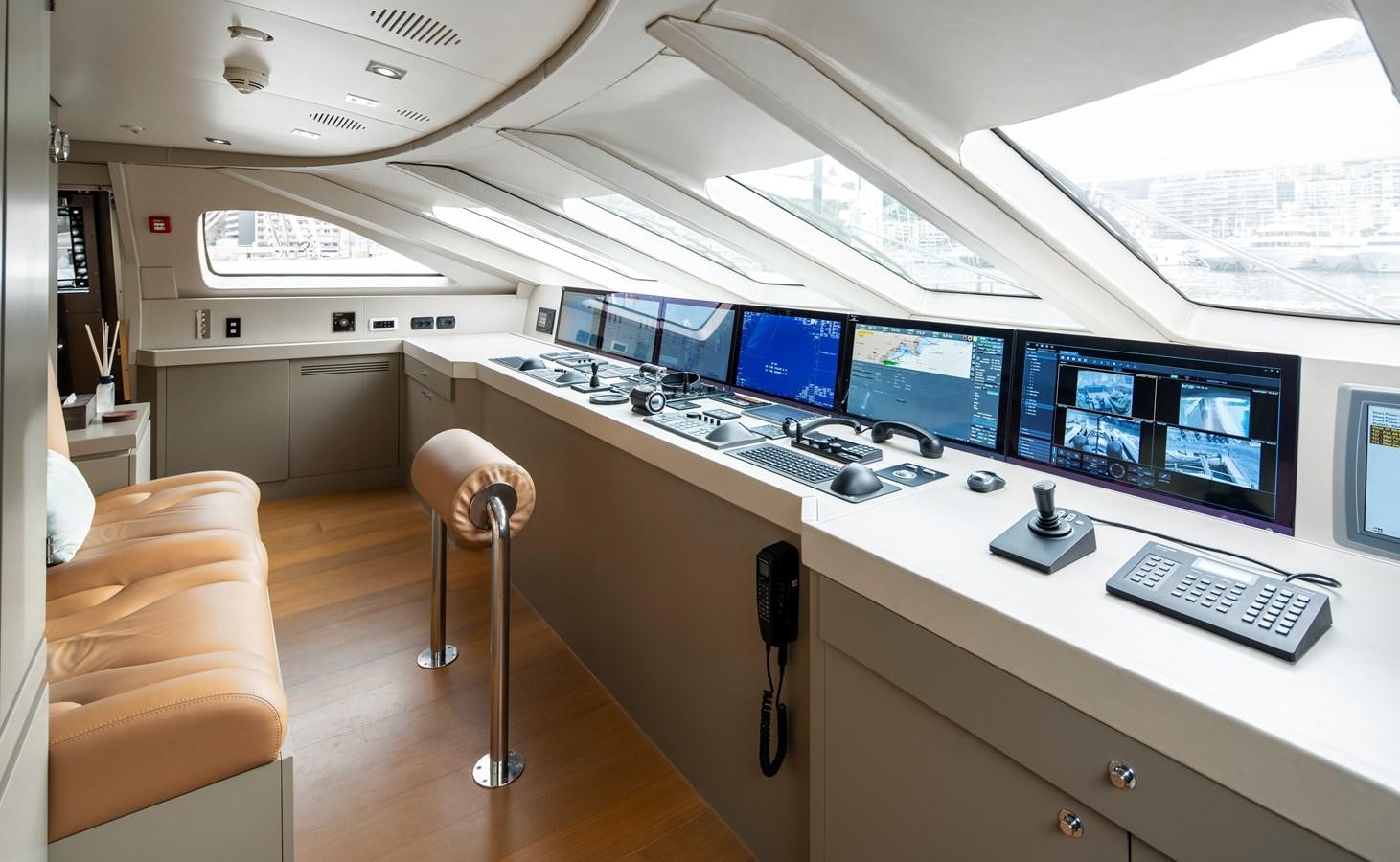 a room with computers and chairs aboard MRS L Yacht for Sale