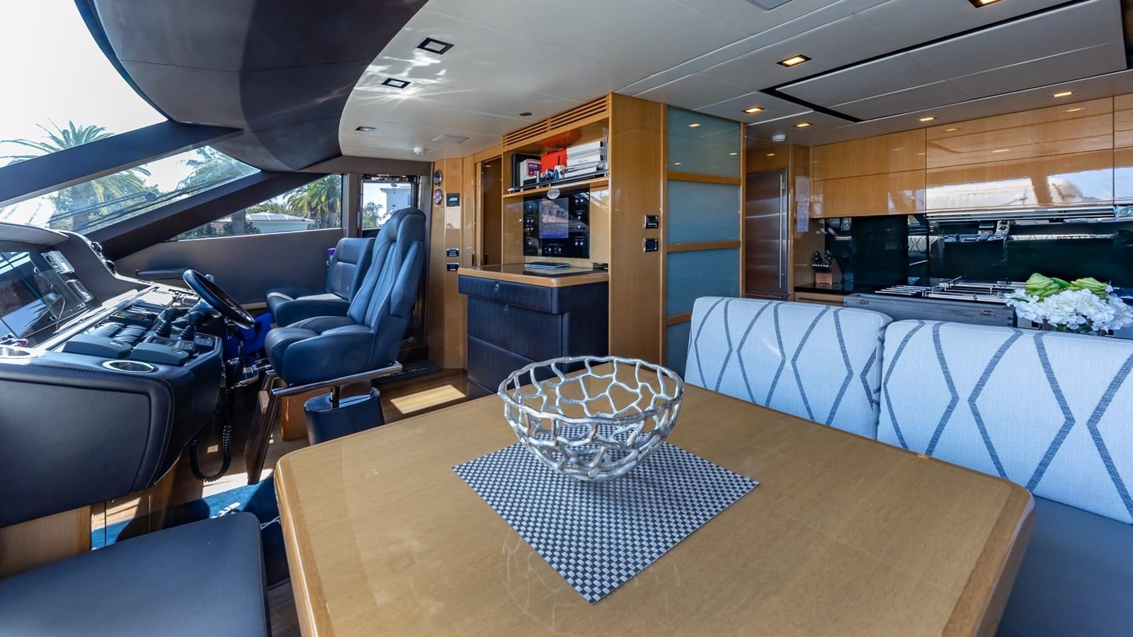 inside of a vehicle with a table and chairs and a large window aboard BELLA RONA Yacht for Sale