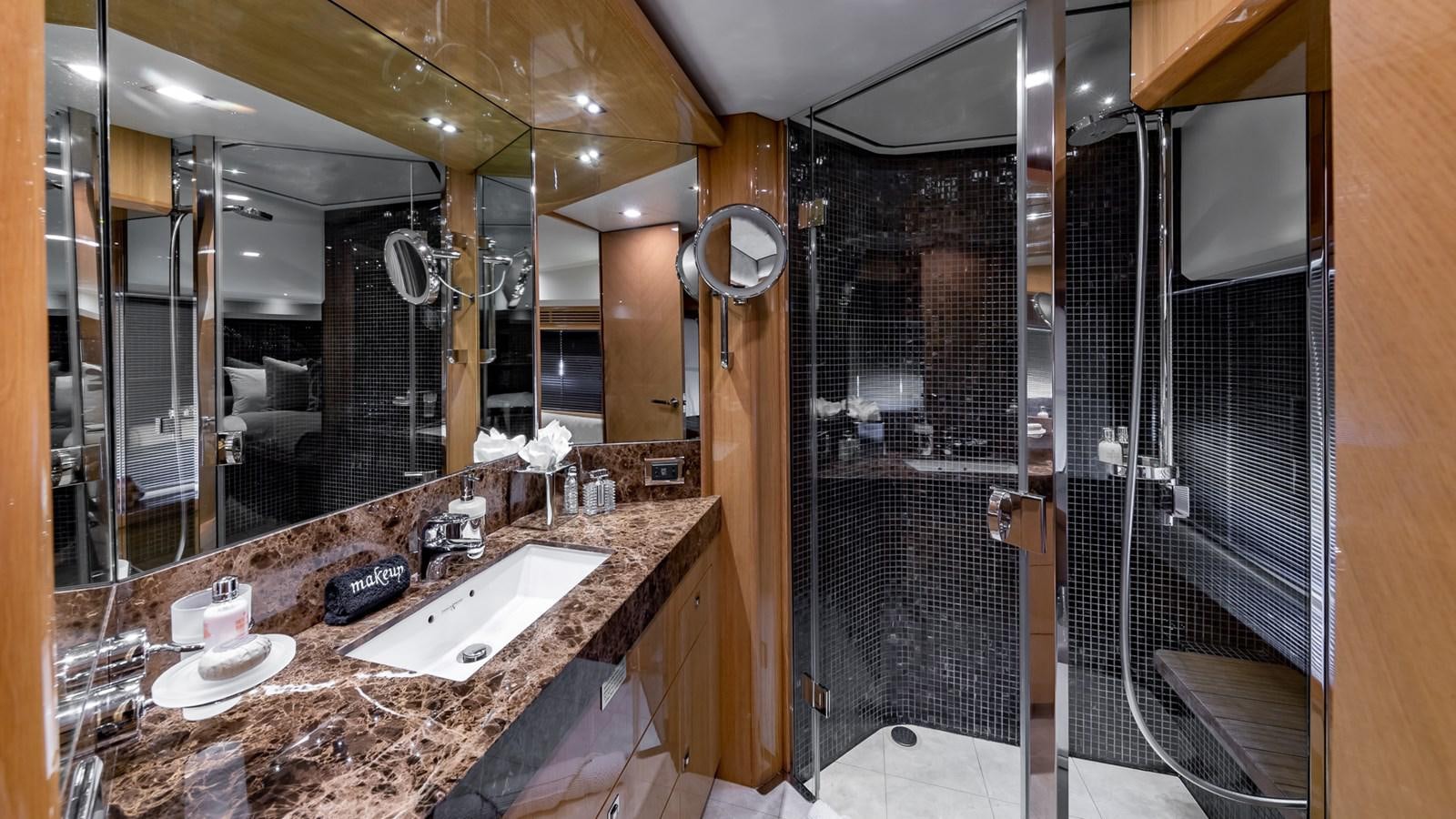 a bathroom with a countertop sink and a large mirror aboard BELLA RONA Yacht for Sale