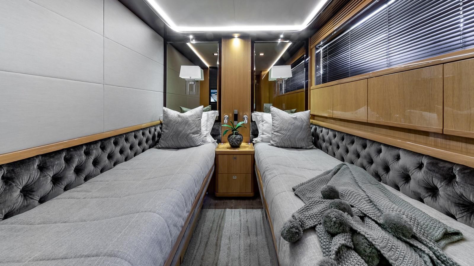 a room with two beds aboard BELLA RONA Yacht for Sale