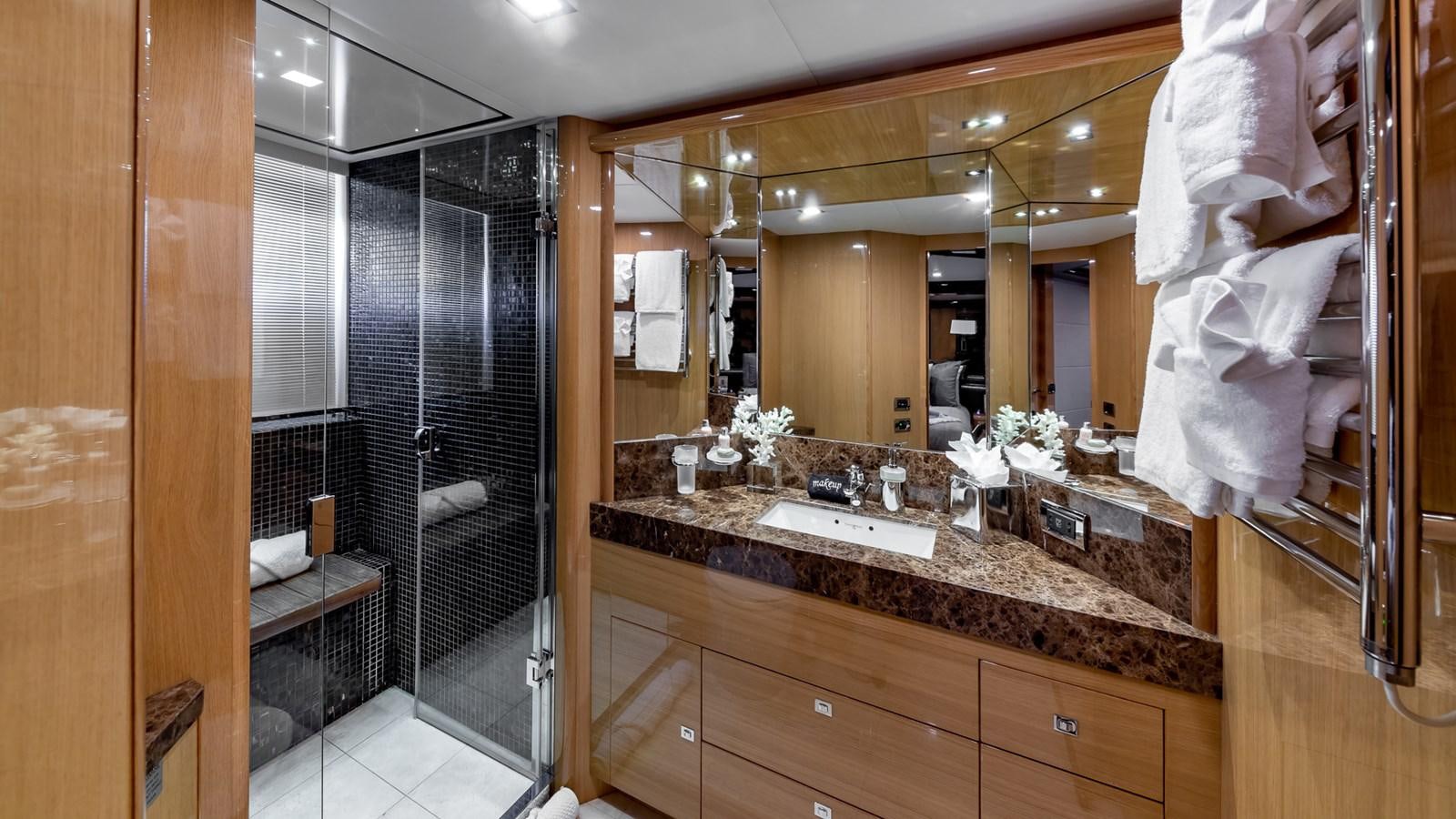 a bathroom with a large mirror aboard BELLA RONA Yacht for Sale