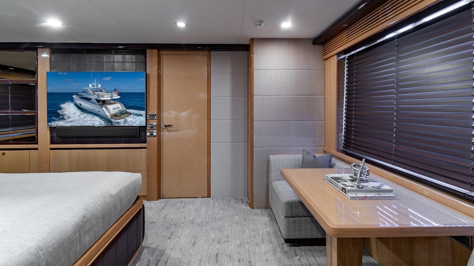 a room with a bed and a desk aboard BELLA RONA Yacht for Sale