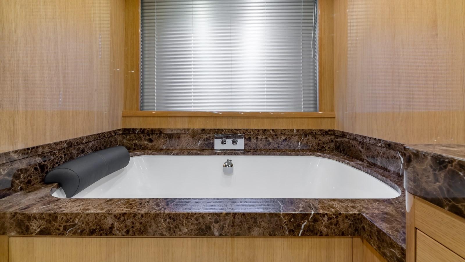 a large jacuzzi tub in a bathroom aboard BELLA RONA Yacht for Sale