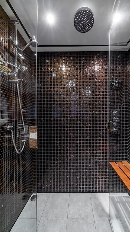 a shower with a tile floor aboard BELLA RONA Yacht for Sale