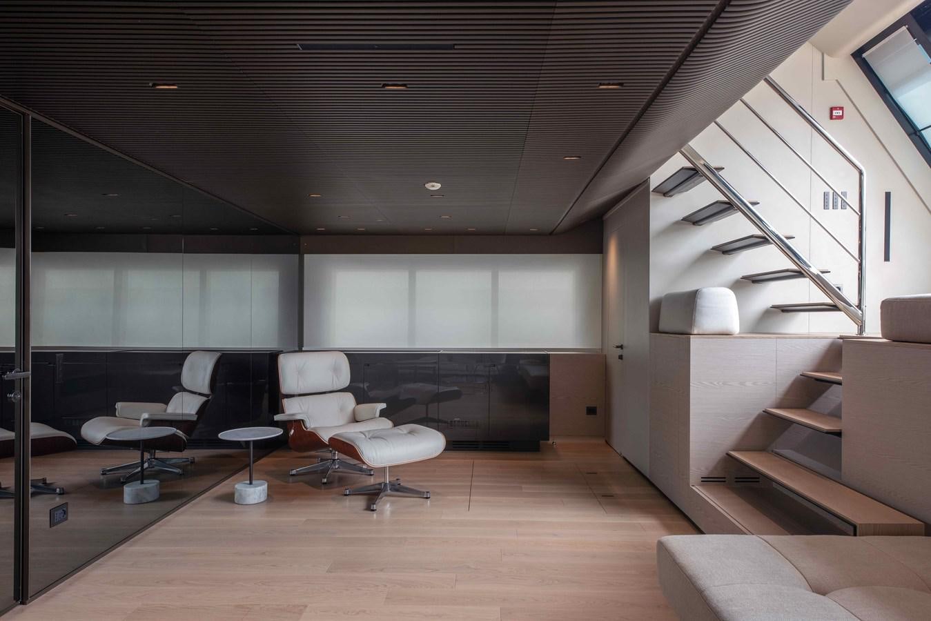 a room with chairs and a staircase aboard SP110-03 Yacht for Sale