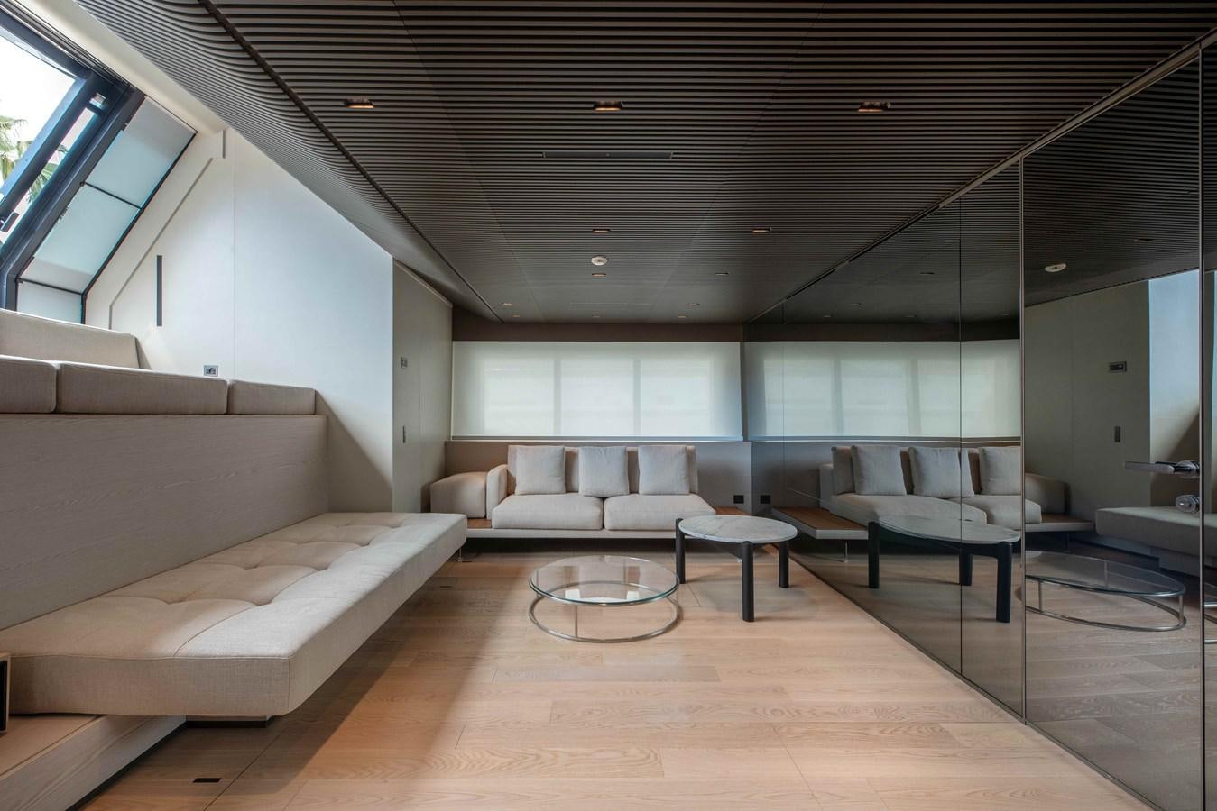 a room with couches and a table aboard SP110-03 Yacht for Sale