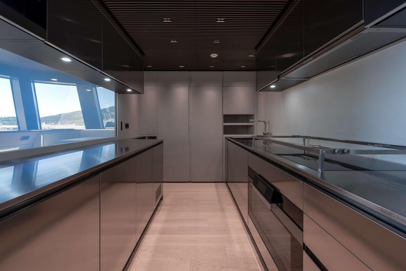 a room with a large window and a large table with chairs aboard SP110-03 Yacht for Sale