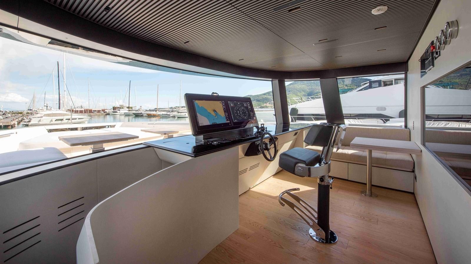 a room with a view of the ocean and a large television aboard SP110-03 Yacht for Sale