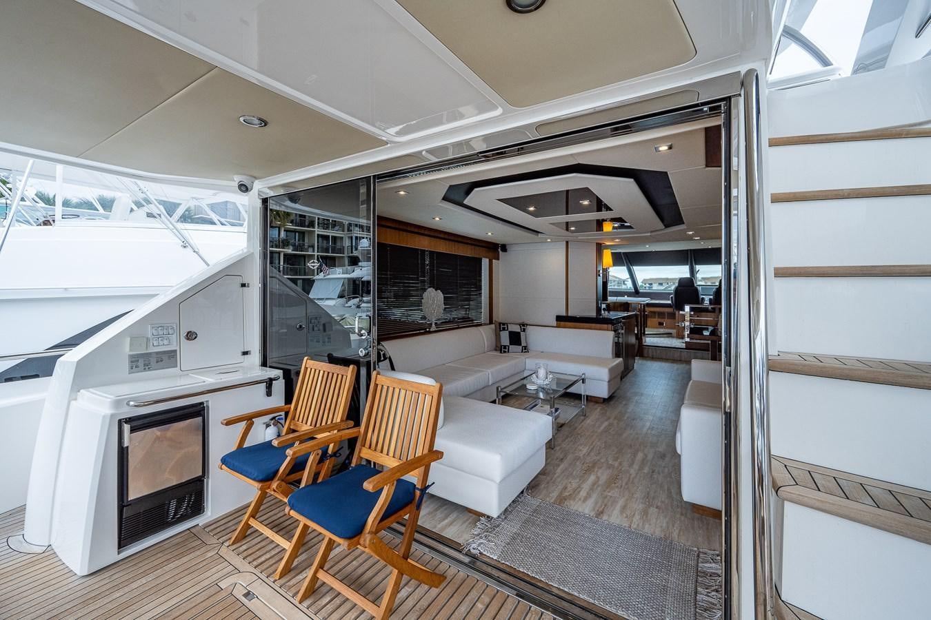 a room with a couch and a television aboard 212 Yacht for Sale