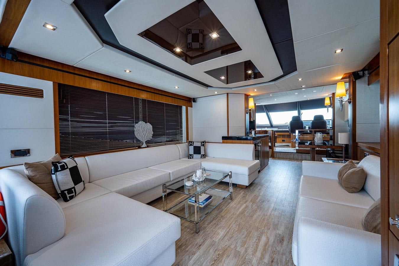a room with couches and a table aboard 212 Yacht for Sale